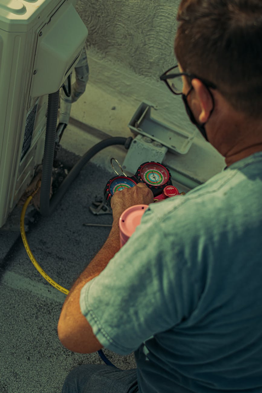 man repairing cables in a car
